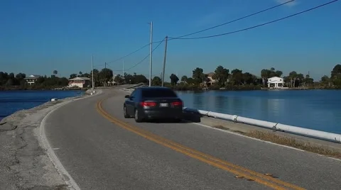 Car driving across low bridge Stock-Footage 45244199