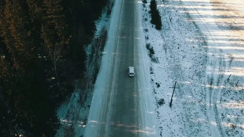 Car Driving Along The Forest Road In Winter Stock Footage 101816974