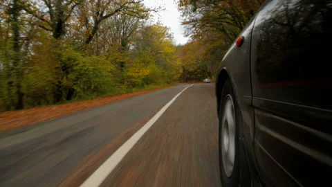 The car is driving along the road in the forest to meet her cars Stock Footage 140222059