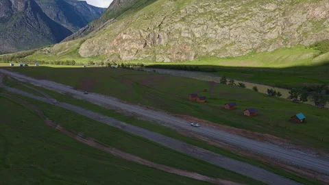Car is driving along the road with a view of the mountains Stock Footage 248343365