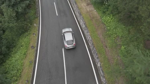 Car Driving on an Alpine Road with Drone Follow Stock Footage 280307199