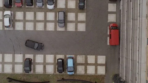 Car driving away from parking lot, color corrected Stock Footage