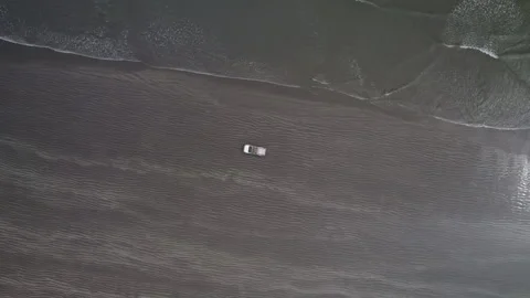 A car driving on black sand drone view Stock-Footage 265242491