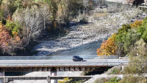 Car Driving on Bridge Over River Stock Footage 265785154