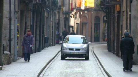 Car driving to camera on narrow old town street Stock Footage 42183688