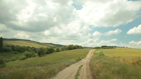 Car driving by country road Stock Footage