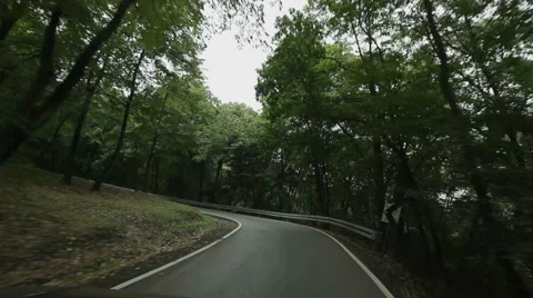 Car driving on curved road Stock Footage 45018946