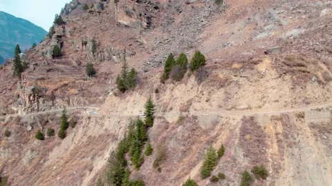 Car Driving on Dangerous Mountain Edge Road – Cliffside Highway Aerial View Stock Footage 334787508