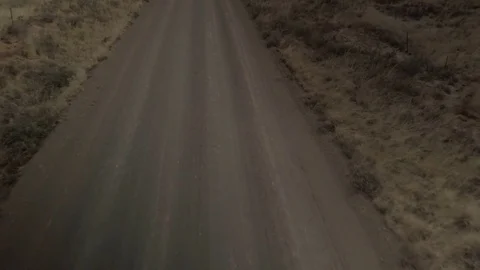Car Driving Down an Empty Road Stock Footage 82629038