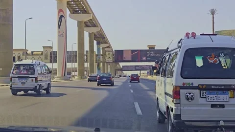 A car driving down a highway with a bridge in the background Stock Footage 291554184