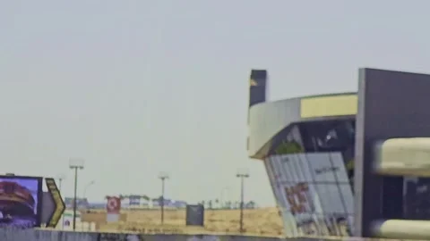 A car driving down a highway next to a wall Stock Footage 291543665