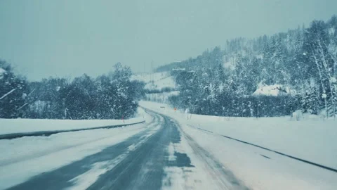 A car driving down the highway through snow blizzard. View through the car Stock-Footage 171758810