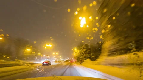 A Car Driving Down the Highway Through Snow. Time Lapse. Stock Footage 229171707