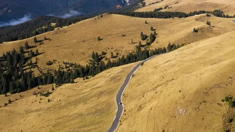 Car driving down on mountain road highway through rural landscape. Stock Footage 150556964