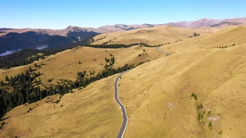 Car driving down on mountain road highway through rural landscape. 스톡 동영상 150556989