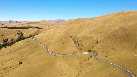 Car driving down on mountain road highway through rural landscape. Stock Footage 150600314