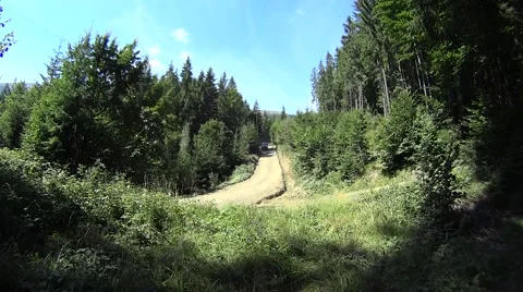 Car driving down on mountainous road in Carpathians, Ukraine Stock Footage 54357010