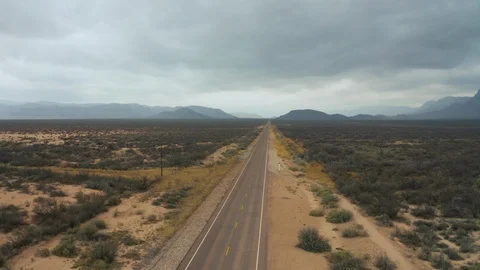 Car driving down open road Drone Shot Stock Footage