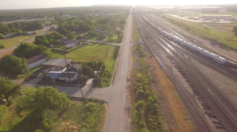Car Driving Down road Next To Train Aerial Houston Stock Footage