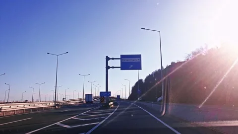 A car driving down a road with a sun shining Stock Footage 273014302