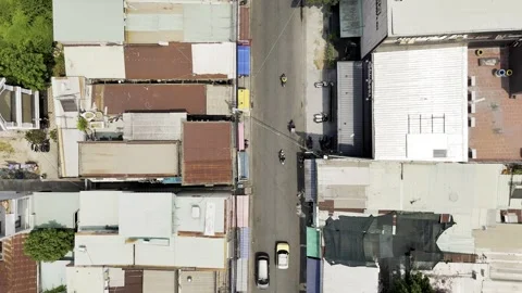 Car is driving down a street in front of a building Stock Footage 330760110
