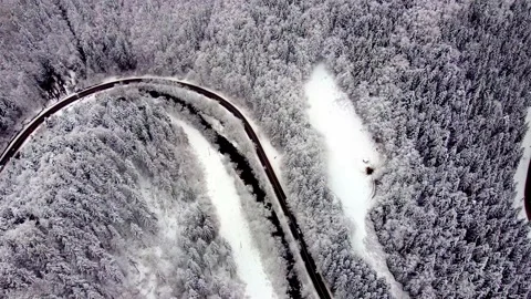 Car driving down winter road and forest with snow covered trees beautiful winter Stock-Footage 235355192