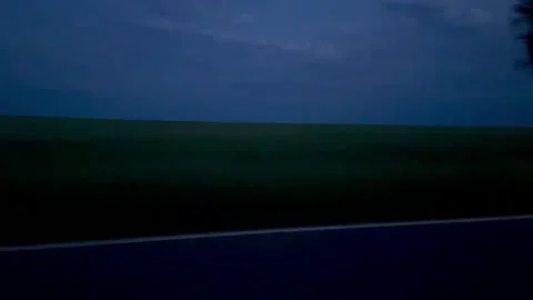 Car driving at dusk Stock Footage 231555982