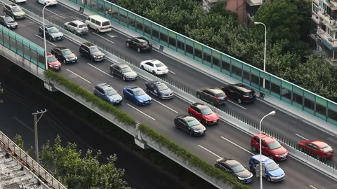 Car driving on an elevated road Stock Footage