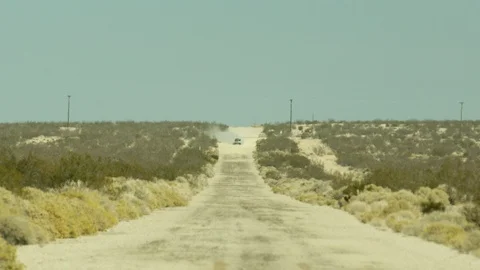 Car driving on empty road Stock Footage 99046130