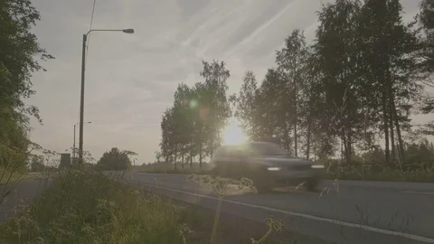 Car driving in the empty rural road during the sunset 스톡 동영상 80929693