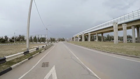 The car is driving exit to highway. Rear view. Stock Footage 81823920