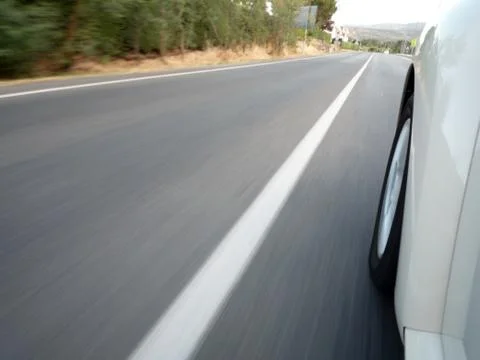 Car driving fast Stock Photos