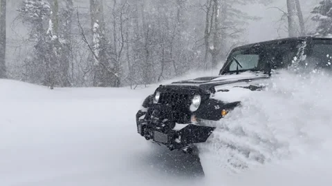 Car Driving Fast Through Heavy Snowfall - Cinematic Side View 4K. Stock Footage 329141443