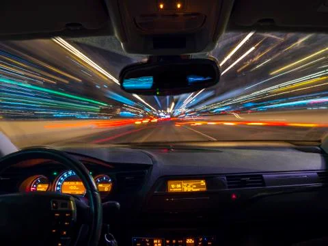 Car driving fast - view from inside a car Stock Photos