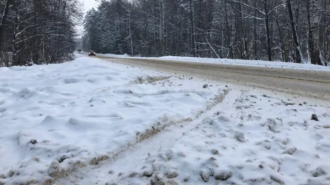 Car driving fast winter road forest low angle Stock Footage 105987016