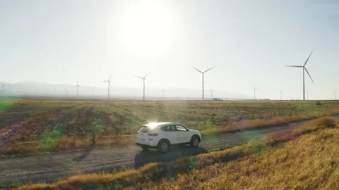 Car driving by the fields and windmills Stock Footage 156233209