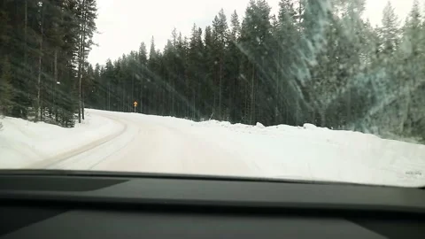 Car Driving On Forest Road Covered In Snow Canada 4K Stockbeeldmateriaal 239167277