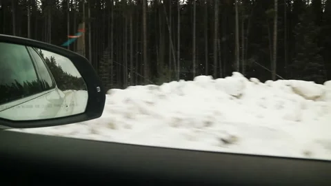 Car Driving On Forest Road Covered In Snow Canada 4K Stock Footage 239167952