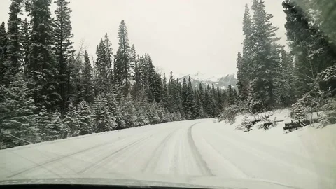 Car Driving On Forest Road Covered In Snow Canada HD Stock Footage 239172830
