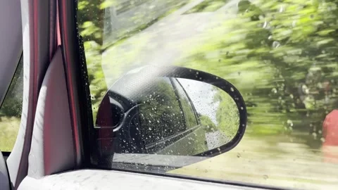 Car driving front mirror rainy weather Stock Footage 276745374