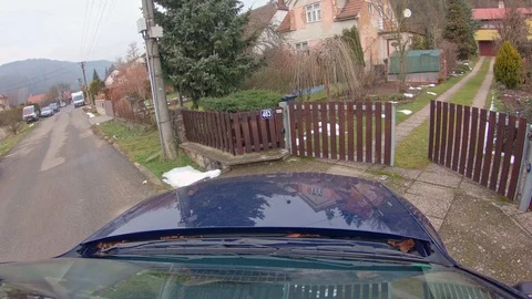 Car driving into garden through automatic gate Stock Footage 86472857