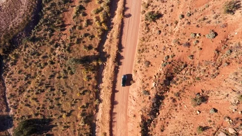 Car Driving On Ground Road Crossing Red Sand Desert On Sunny Day Aerial Top View Stock Footage 273798664