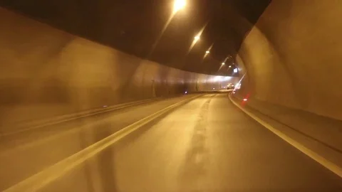 Car driving highway and through tunnel Stock Footage