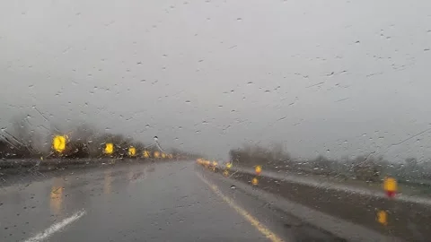 Car driving on a highway during rain Stock Footage 280640146