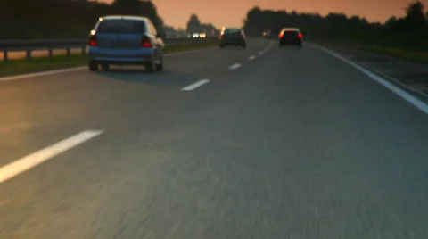 Car driving on highway in sunset Stock Footage 878029