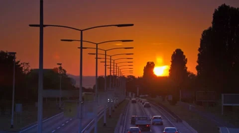 Car Driving on highway at sunset Stock Footage 8683399