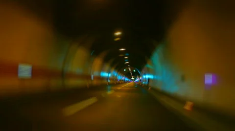 Car driving on highway tunnel looping Stock Footage 698341