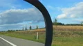 Car driving on highway, view from passenger seat. Fields and forest on roadside HD Footage