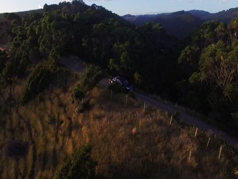 Car driving on hill by ocean Stock Footage 73553243