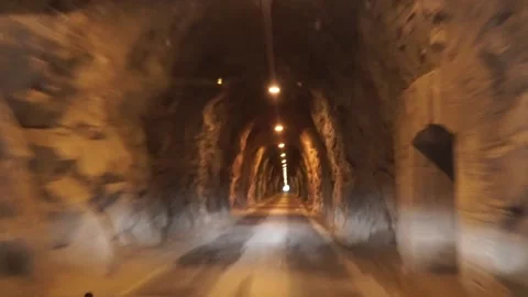 Car driving inside a tunnel - Bad bumpy road Stock Footage 134494609